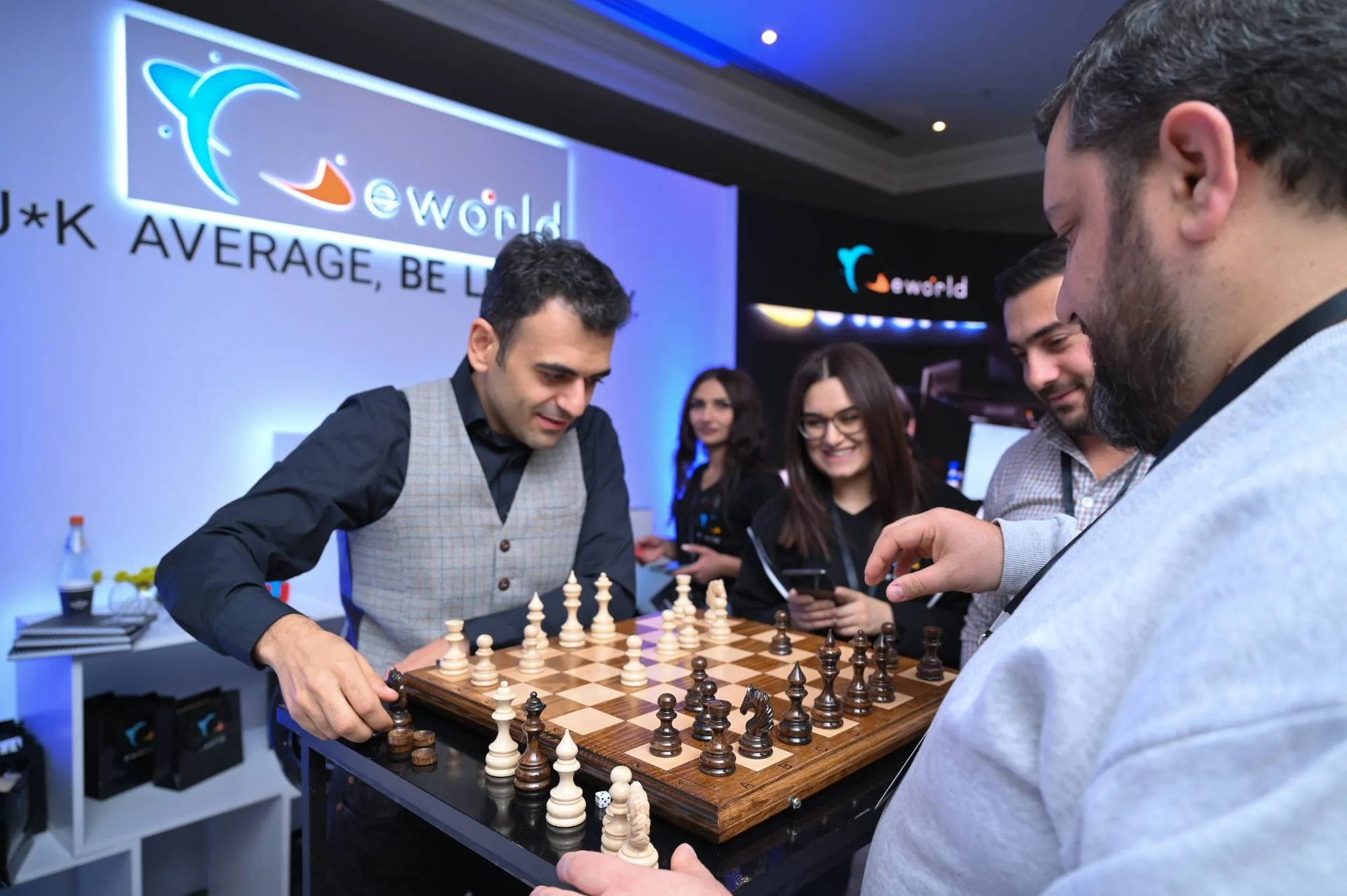 Colleagues playing chess during an eWorld event