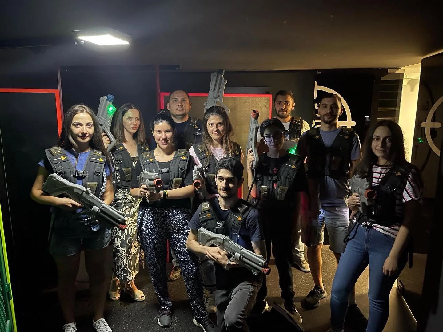 eWorld colleagues taking part in a laser-tag team activity